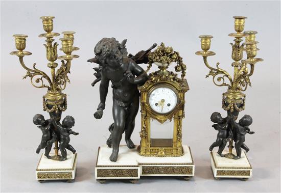 An early 20th century French bronzed spelter, ormolu and white marble clock garniture, 21.5in.